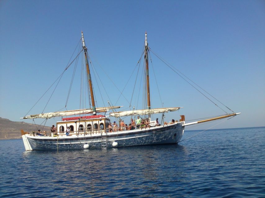 Corfu Town: Full-Day Cruise with Lunch, Drinks & Swim Stops - Nissaki swim stop: cliffs, calm water, and an easy first splash