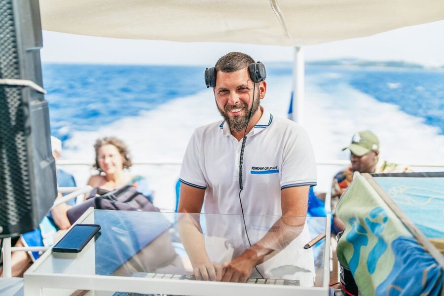 From Corfu Island: Antipaxos & Paxos Blue Caves Boat Cruise - The boat vibe on Ionian Cruises: bar, music, and Greek dancing