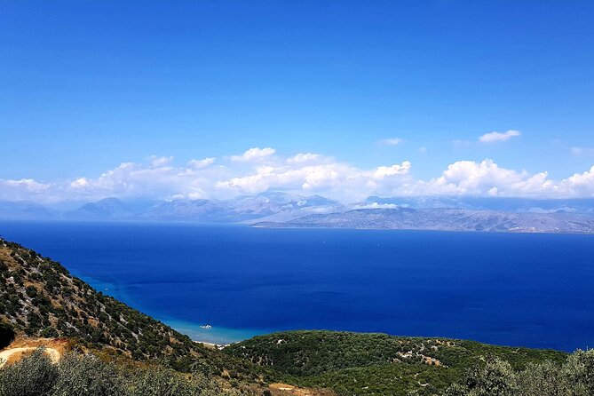 Northwest Corfu 4x4 Coastal Dreams & Village Charms Experience - Loggas Beach photo stop: big cliffs, quick magic