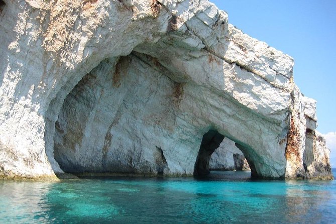 Parga, Sivota and Blue Lagoon Cruise - Boat storytelling in Sivota: caves, WWII myths, and real coastline drama